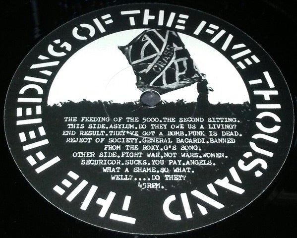 Image of Label Cover of 5014387C: 7" - CRASS, The Feeding Of The 5000 (The Second Sitting) (Crass Records; 621984, UK 1980s Reissue, Fold Out Sleeve, No 'Pay No More' on Sleeve, No 'Made in France' on Labels) All round strong VG, Sleeve has light wear to edges but is fully intact, Vinyl is glossy with a couple of light hairlines  VG/VG