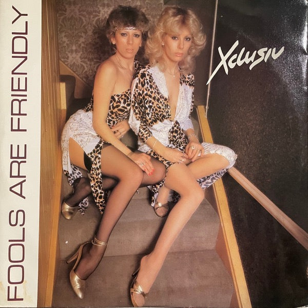 Image of Front Cover of 0615365C: 12" - XCLUSIV, Fools Are Friendly (Le Maitre Music; KA100-12, UK 1982, Picture Sleeve) Sleeve has water damage which has cause some surface tears to front. Seams are still held together. Labels are clean. Disc has only a few very light marks -  strong VG, plays great.  G/VG