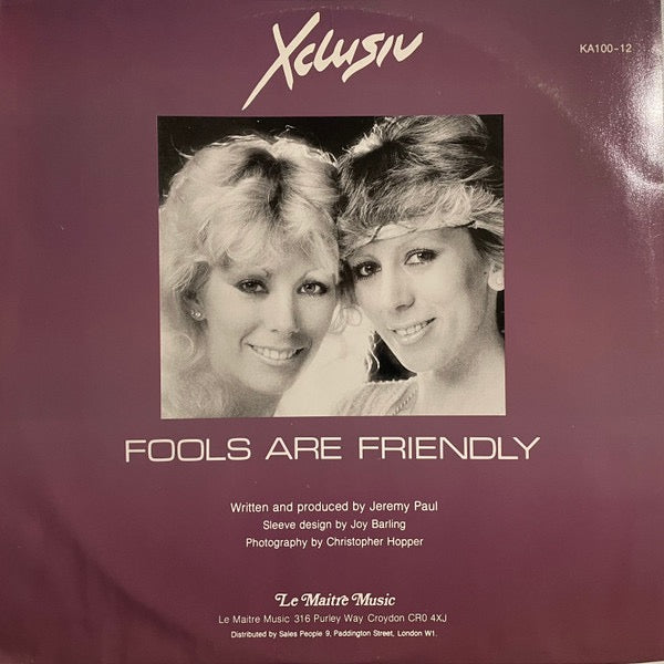 Image of Back Cover of 0615365C: 12" - XCLUSIV, Fools Are Friendly (Le Maitre Music; KA100-12, UK 1982, Picture Sleeve) Sleeve has water damage which has cause some surface tears to front. Seams are still held together. Labels are clean. Disc has only a few very light marks -  strong VG, plays great.  G/VG