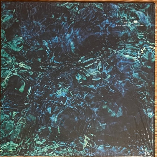 Image of Front Cover of LP - NEW/NEW - ICHIKO AOBA, Luminescent Creatures (Hermine; HERM003LP, Europe 2025, Poster), , To listen to Ichiko Aoba is to be drawn into a world as intimate as a warmly lit home, but cosmic in scale. The Japanese singer, songwriter, composer, and multi-instrumentalist, has taken a dedicated online fanbase built from TikTok sounds and critically acclaimed, and translated that into international tours spanning more than 20 countries. She was well known in Japan collaborating with ar