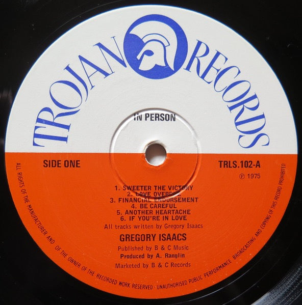 Image of Label Cover of LP - VG/G+ - GREGORY ISAACS, In Person (Trojan Records; TRLS 102, UK 1980s Reissue, Glossy Sleeve), Lots of light marks, plays through ok. Quite a bit of wear on sleeve, yellowing, still looks ok.,  - 2426194E