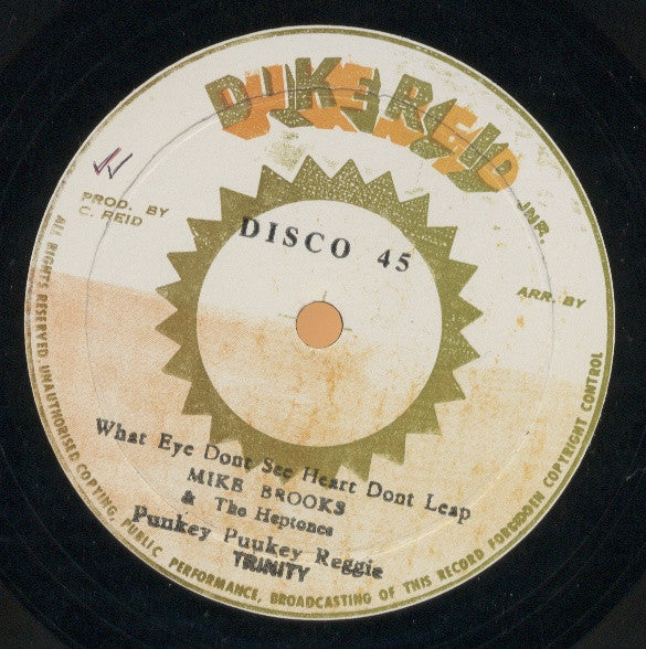 Image of Label Cover of LP - F/VG - MIKE BROOKS & THE HEPTONES / TRINITY / ANSLE COLLINS, What Eye Dont See Heart Dont Leap / Punkey Puukey Reggie / Punkey Dub & Punkey Rock (Duke Reid Jnr.; , Jamaica 1970s, Picture Sleeve), Light marks on disc. Sleeve shows heavy wear, partial splits and fraying to the opening.,  - 2045272S
