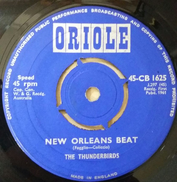 Image of Front Cover of 2515082C: 7" - THE THUNDERBIRDS, New Orleans Beat (Oriole; 45-CB 1625, UK 1961, Company Sleeve) Knocked out center, Fair few hairlines, Plays well with little surface noise, Cut loud, Sleeve a little tatty but intact.   G+/G+
