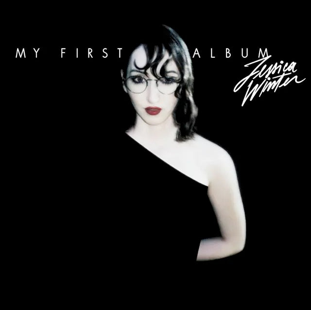 Image of Front Cover of LP - NEW/NEW - JESSICA WINTER, My First Album (Lucky Number; LUCKY183LP, Worldwide 2025, Barcode Stickered Poly Outer, Inner, Transparent Black Ice Vinyl), , Jessica Winter s debut My First Album is a fully realised bold, questioning album, full of personality sitting somewhere on the spectrum between therapy and the dancefloor. Musically there are shades of Kylie Minogue and the glitter of 80s Madonna, there s the flamboyance of Prince and Queen, the energy and occasional snarl of p