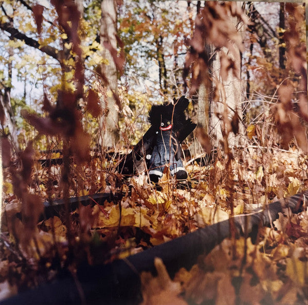 Image of Front Cover of 2xLP - NEW/NEW - BILLY WOODS, Golliwog (Backwoodz Studioz; BWZ804, US 2025, Gatefold, Insert, Black Vinyl), , GOLLIWOG is billy woods  first album in two years, preceded by 2023 s Maps, his second collaboration with producer Kenny Segal. That nimble travelogue has little in common with woods  newest work, despite the fact that Segal shows up a couple times in the credits. GOLLIWOG is a haunting collection that weaves horror, humor, surrealism and Afropessimism into a cinematic tapest