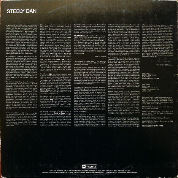 Image of Back Cover of 4625242E: 7" - STEELY DAN, Aja (ABC Records; AB 1006, US 1977, Insert, Alternate Text Layout on Labels: "(P) ABC Records, Inc." in One Line) Strong G+ all around. Dishing to disc. Scuffs, mottling and hairlines. Ring and edge wear, large corner crease.   G+/G+