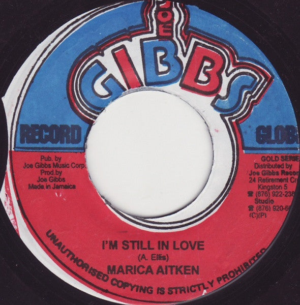 Image of Front Cover of 7" - /VG - MARCIA AITKEN / TRINITY, I'm Still In Love / Top Ranking (Joe Gibbs Record Globe; , Jamaica 1990s Reissue, Misprint), Shopstock. Foggy press like all copies, light background.,  - 4815208C