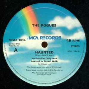 Image of Label Cover of 5015300C: 12" - THE POGUES, Haunted (MCA Blue Rainbow; MCAT 1084, UK 1986, , Picture Sleeve, "From The Motion Picture Soundtrack SID & NANCY") A little light edge wear.  VG+/VG+
