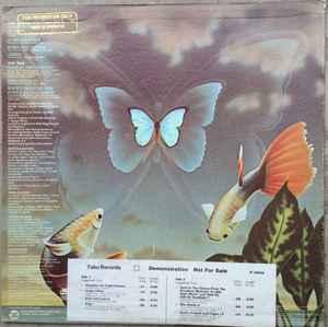 Image of Back Cover of LP - G+/VG+ - MANFREDO FEST, Manifestations (Tabu Records; JZ 35636, US 1979, Promo), Light marks. Promo paper strip &  stamp on back of sleeve & name in marker pen. Wear to sleeve with tear on bottom of front & back sleeve.,  - 2326075E