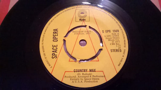Image of Front Cover of 0316300C: 7" - SPACE OPERA, Country Max (Epic; S EPC 1569, UK 1973, Promo, Company Sleeve, 4 Prong Centre) Clean glossy disc, Nice comapny sleeve, Just some sticker residue on label and name writen on label, Centre intact.   VG+/VG+