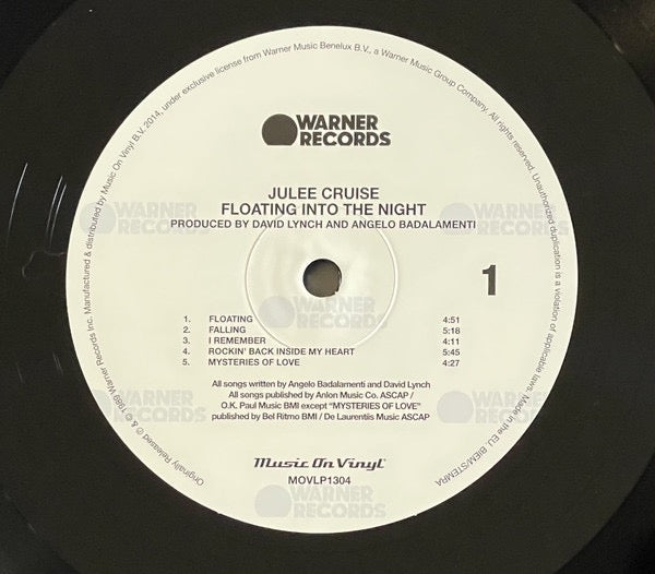 Image of Back Cover of LP - NEW/NEW - JULEE CRUISE WITH ANGELO BADALAMENTI, Floating Into The Night (Warner Records; MOVLP1304, Europe 2000s Reissue, Insert, 180 Gram Vinyl. Twin Peaks Singer), , The haunting debut album by Julee Cruise, who played the nightclub singer in Twin Peaks, is made up of her songs on David Lynch soundtracks and original songs.Mysteries of Love is on Blue Velvet (Original Motion Picture Soundtrack).Falling, Into The Night and The Nightingale are on Soundtrack From Twin Peaks (wh