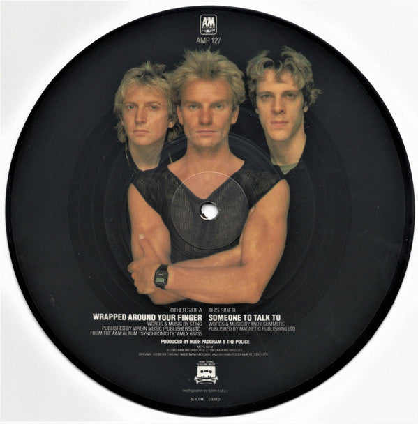 Image of Back Cover of 7" - VG+/VG+ - THE POLICE, Wrapped Around Your Finger / Someone To Talk To (A&M Records ; AMP 127, UK 1983, Plastic Sleeve, Picture Disc, Stewart Copeland Photo), Strong VG+, Sleeve Creased,  - 0926400E