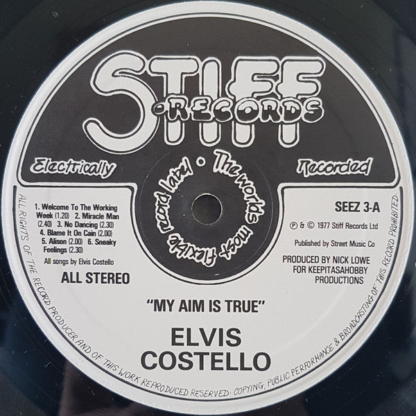 Image of Label Cover of LP - VG/EX - ELVIS COSTELLO, My Aim Is True (Stiff Records; SEEZ 3, UK 1978, Green front and back), Black Inner, Edge and Ring Wear,  - 2326145E