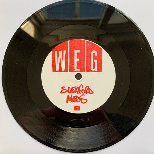 Image of Label Cover of 7" - VG+/EX - SLEAFORD MODS, West End Girls (Rough Trade ; RT0462SWLE, UK 2023, Hand Stamped White Label, Tour Single), Label Stamp Slightly Smudged, Light Inky Fingerprints On Plain Sleeve,  - 1026068E