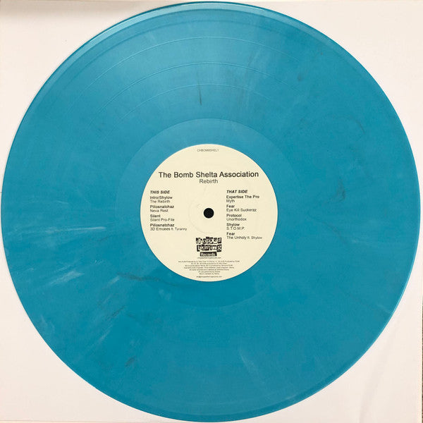 Image of Label Cover of 12" EP - /G - THE BOMB SHELTA ASSOCIATION, Rebirth (Chopped Herring Records; CHBOM8SHEL1, UK 2019, Stickered Plain Sleeve, Aqua Vinyl), A deep mark on track A3 clicks lightly when played through, A1	Shylow   Intro / The RebirthA2	Pillosnatchaz   Neva RestA3	Silent   Silent Pro-FileA4	Pillosnatchaz   3D EmceesB1	Expertise The Pro   MythB2	Fear   Eye Kill SuckerzzB3	Protocol   UnorthodoxB4	Shylow   S.T.O.M.P.B5	Fear   The Unholy - 1016525C
