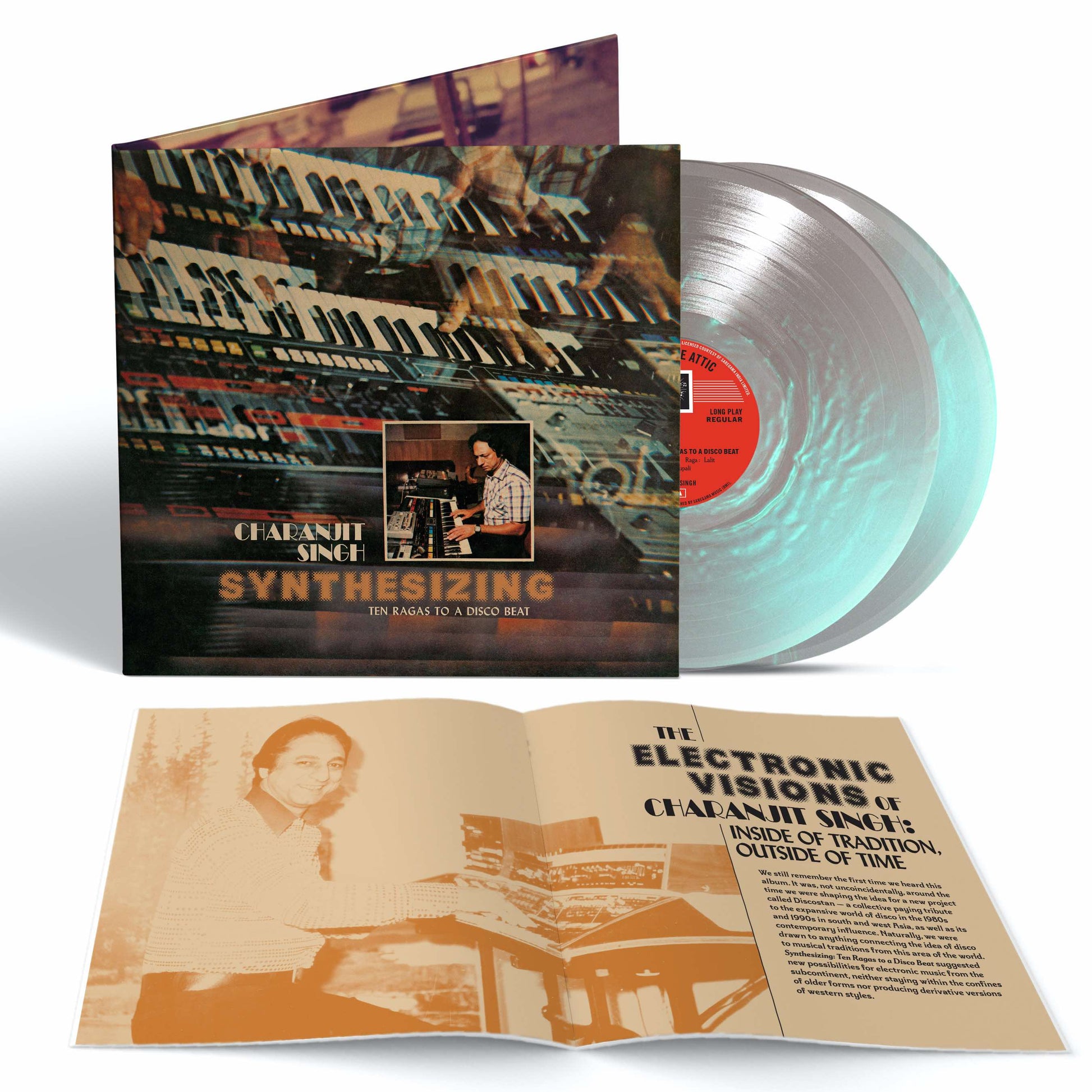 Image of Back Cover of 2xLP - NEW/NEW - CHARANJIT SINGH, Synthesizing: Ten Ragas to a Disco Beat (Light in the Attic; LITA22611, Europe 2026 Reissue, Gatefold, 16 Page Booklet, Pearlescent Transcendent Future Colour Vinyl), , Light in the Attic is honored to announce the long-awaited reissue of Synthesizing: Ten Ragas to a Disco Beat, the revolutionary 1982 album from composer and musician Charanjit Singh. Pairing Indian classical ragas with then-state-of-the-art Roland synthesizers and drum machines, Singh