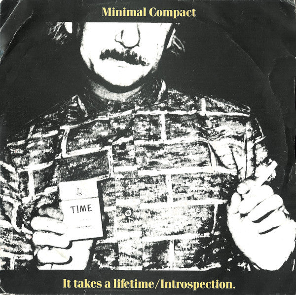 Image of Front Cover of 7" - G+/VG - MINIMAL COMPACT, It Takes A Lifetime / Introspection. (Crammed Discs; CRAM 7457, Belgium 1982, Picture Sleeve), Slight crease and rip to cover. ,  - 1156000S