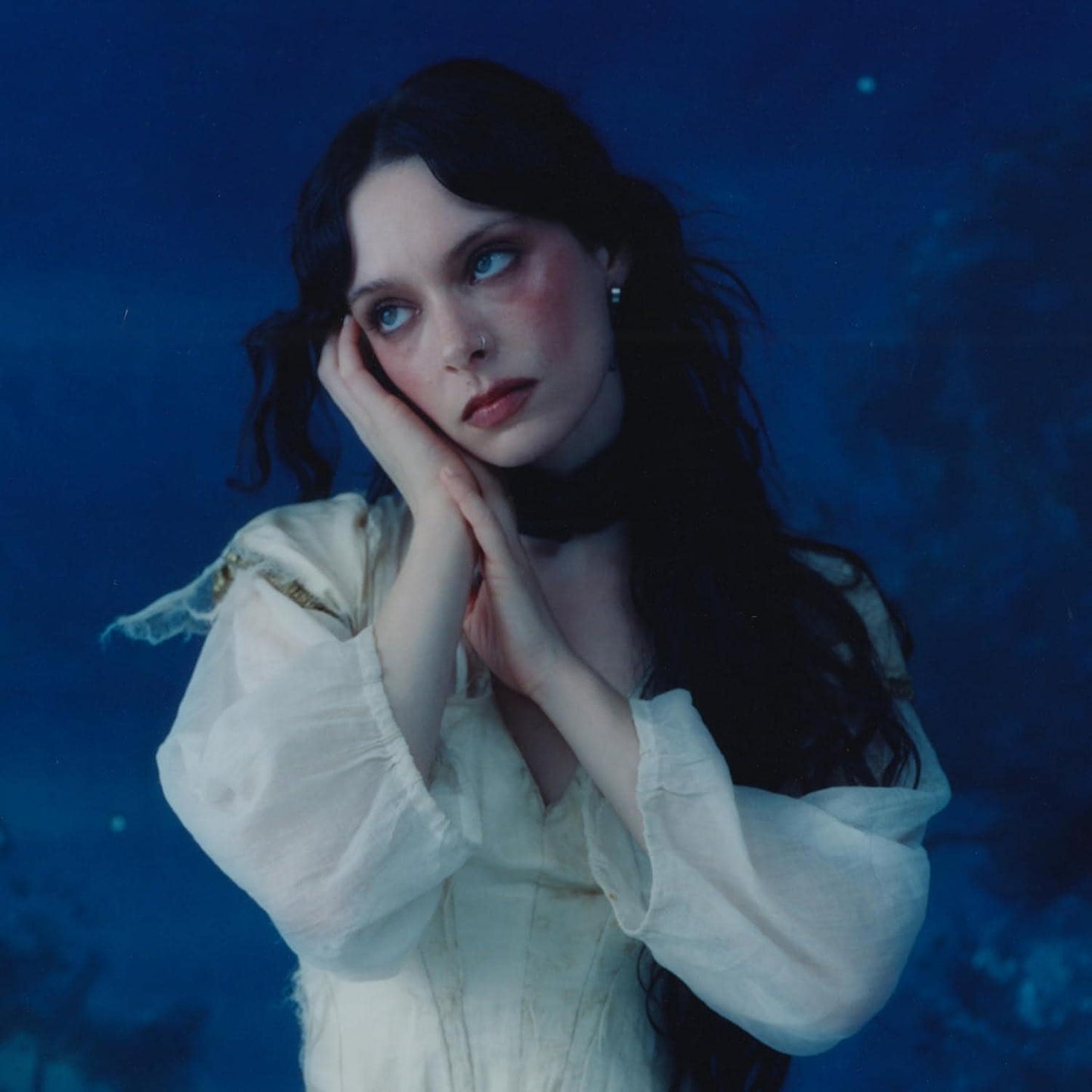 Image of Front Cover of LP - NEW/NEW - HOLLY HUMBERSTONE, Cruel World (Polydor; 8811372, Europe 2026, Indie Exclusive Pearl White Vinyl), , Holly Humberstone returns with her highly anticipated second album, Cruel World, set for release on 10 April 2026. One of the defining voices of her generation, Holly delivers a record that lives in the tension between pain and pleasure, where chaos and acceptance sit side by side.Renowned for her forensic songwriting — earning an Ivor Novello nomination for her debut