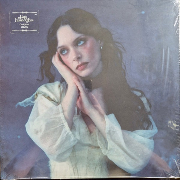 Image of Front Cover of LP - NEW/NEW - HOLLY HUMBERSTONE, Cruel World (Polydor; 8811372, Europe 2026, Inner, Poster, Indie Exclusive Pearl White Vinyl), , Holly Humberstone returns with her highly anticipated second album, Cruel World, set for release on 10 April 2026. One of the defining voices of her generation, Holly delivers a record that lives in the tension between pain and pleasure, where chaos and acceptance sit side by side.Renowned for her forensic songwriting   earning an Ivor Novello nominatio
