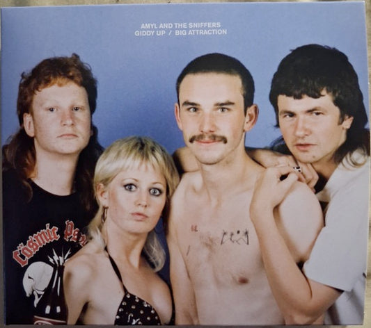 Image of Front Cover of CD - NEW/NEW - AMYL AND THE SNIFFERS, Giddy Up / Big Attraction (10 Year Anniversary) (Virgin; B2B006CD, UK 2026), , Ten years ago, in a shared house on Chapel Street, four20-year-olds with zero expectations wrote and recorded anEP in a single afternoon. Those six blistering minutes ofmusic became  Giddy Up . An hour later, Amyl and TheSniffers had a name and the beginnings of a legacy. As Amy recalls:  We recorded and wrote over theafternoon  we d never played together before that d