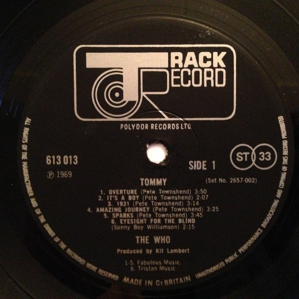 Image of Label Cover of 2xLP - VG+/EX - THE WHO, Tommy (Track Record Black Auto-Coupled Labels; 2657 002, UK 1970s Reissue, Triple Gatefold With Patent Pending Above Track Logo On Rear Sleeve, Unnumbered Limited Edition Booklet), Clean copy, Super glossy discs. ,  - 1816194C
