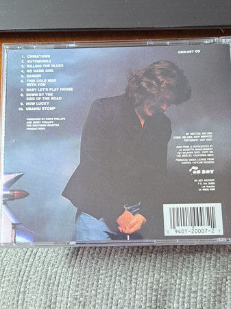 Image of Back Cover of CD - VG/VG+ - JOHN PRINE, Pink Cadillac (Oh Boy Records; OBR007CD, US 2000s Reissue), Drill Hole,  - 1916163C