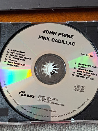 Image of Label Cover of CD - VG/VG+ - JOHN PRINE, Pink Cadillac (Oh Boy Records; OBR007CD, US 2000s Reissue), Drill Hole,  - 1916163C