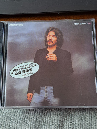 Image of Front Cover of CD - VG/VG+ - JOHN PRINE, Pink Cadillac (Oh Boy Records; OBR007CD, US 2000s Reissue), Drill Hole,  - 1916163C