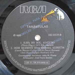 Image of Label Cover of 7" - VG/G+ - TAR NTULAS, M os Ao Alto / Cilada / Ilha Do Sol / Dom Quixote (RCA; 102.0335, Brazil 1982, Picture sleeve), Light marks. Ringwear & sticker on sleeve., A1 - M os Ao Alto (Hands Up) (Give Me Your Heart)A2 - CiladaB1 - Ilha Do SolB2 - Dom Quixote (Don Quijote) - 1926133E