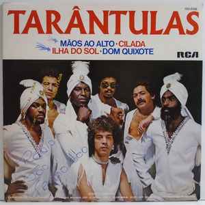 Image of Front Cover of 7" - VG/G+ - TAR NTULAS, M os Ao Alto / Cilada / Ilha Do Sol / Dom Quixote (RCA; 102.0335, Brazil 1982, Picture sleeve), Light marks. Ringwear & sticker on sleeve., A1 - M os Ao Alto (Hands Up) (Give Me Your Heart)A2 - CiladaB1 - Ilha Do SolB2 - Dom Quixote (Don Quijote) - 1926133E