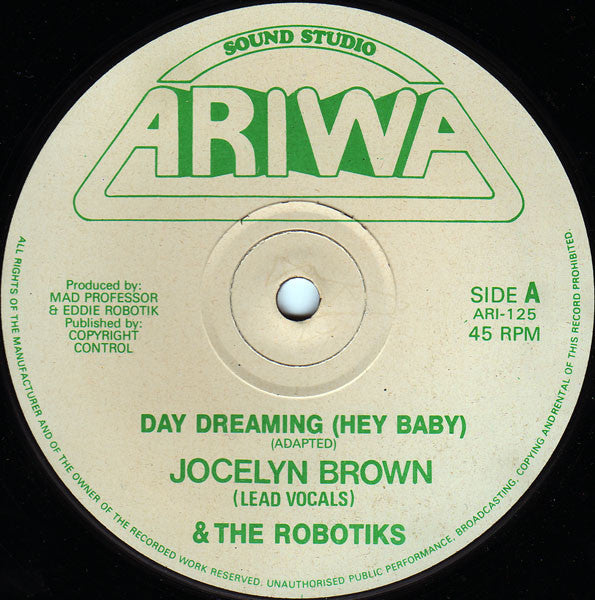 Image of Front Cover of 12" - G+/VG+ - JOCELYN BROWN & THE ROBOTIKS, Day Dreaming (Hey Baby) (Ariwa; ARI 125, UK 1990, Reggae Disco 45 sleeve), Wear to Reggae Disco sleeve with writing.,  - 2146178S