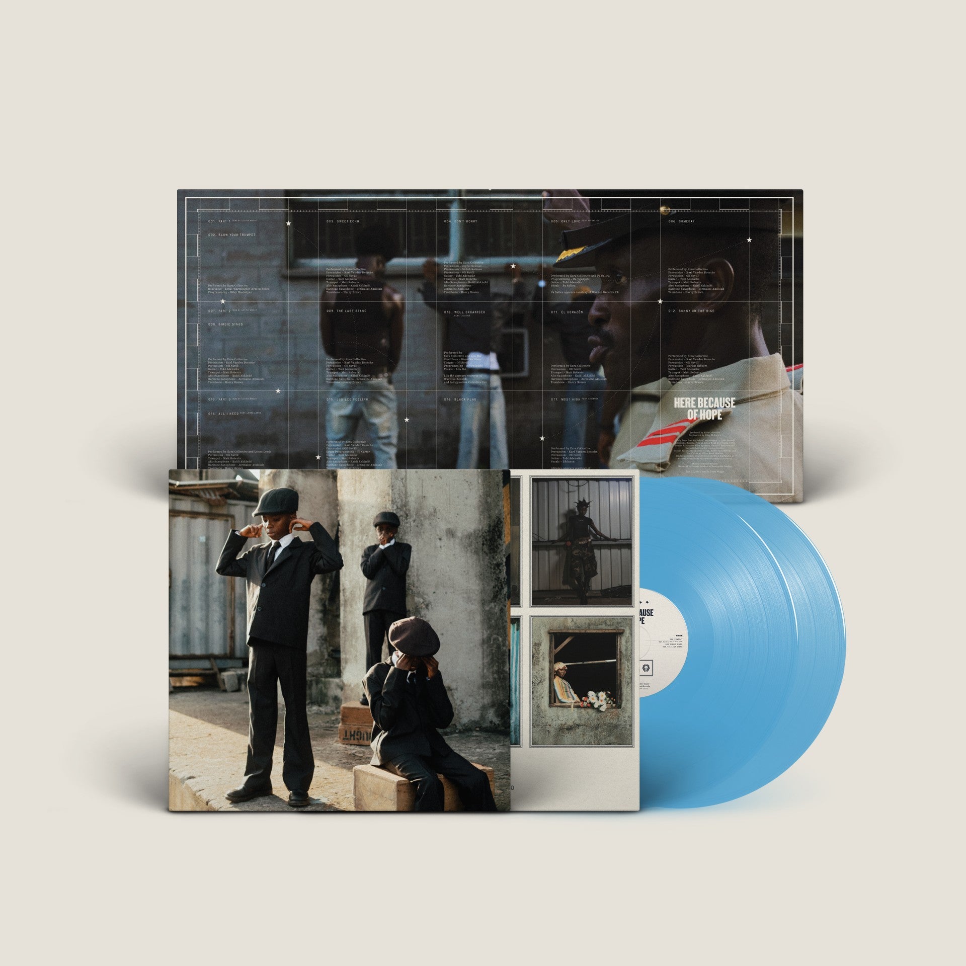Image of Back Cover of 2xLP - NEW/NEW - EZRA COLLECTIVE, Here Because of Hope (Partisan Records; PTSN3069-3, UK 2026, Gatefold, Inner, Transparent Ocean Blue), ,  Ezra Collective's Here Because Of Hope is the most ambitious and personal record of their career - conceived as a body of work split into three spiritual and geographical movements, the album traces the movement of Black people across continents and decades, from the music of Africa to the rhythms of the Caribbean, and home to the streets of Londo