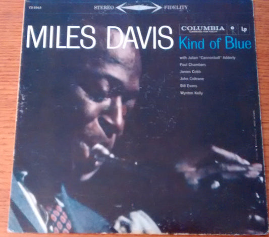 Image of Front Cover of LP - G+/G+ - MILES DAVIS, Kind Of Blue (Columbia; CS 8163, US 1959, Original U.S. pressing), Record has hairlines in line with a VG but there's a patch of side 1 that looks like it's been stained - does not clean off. This patch provides audible crackle, other pops and crackle too elsewhere. Side 2 has less surface noise. Sleeve has edgewear and spotty ringwear. Discolouration to rear sleeve.,  - 2226357E