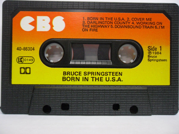 Image of Label Cover of Cassette - VG+/VG+ - BRUCE SPRINGSTEEN, Born In The U.S.A. (CBS Orange/Yellow; 40-86304, UK 1984, Black Shell With Larger Window, No Timing Numbers), ,  - 2316205C
