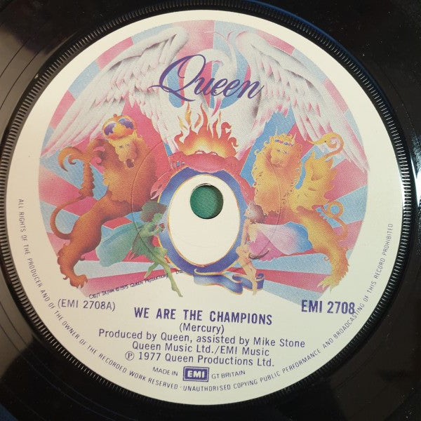 Image of Label Cover of 7" - VG/G+ - QUEEN, We Are The Champions (EMI; EMI 2708, UK 1977, Picture Sleeve, Solid Centre), Edge and ring wear. Hairlines on disc.,  - 2356119S