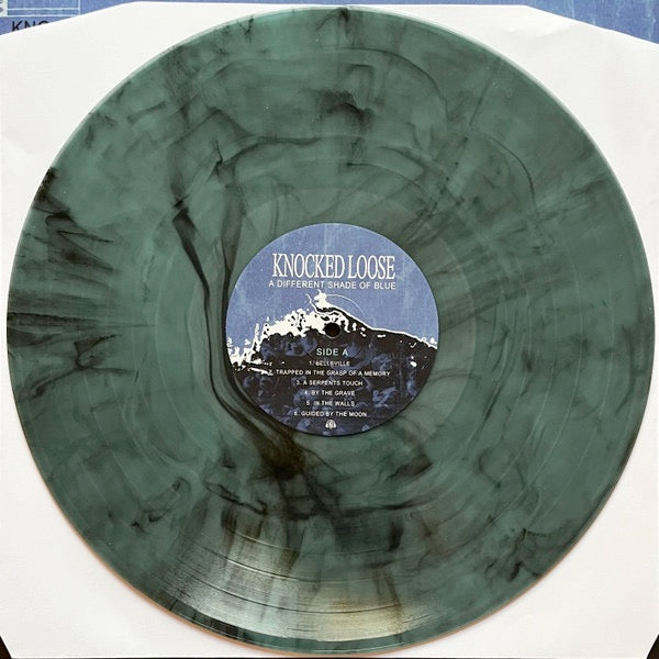 Image of Back Cover of LP - NEW/NEW - KNOCKED LOOSE, A Different Shade of Blue (Pure Noise Records; PNE24715, UK 2026 Reissue, Electric Smoke Vinyl), , Knocked Loose have announced their hotly anticipated new album, A Different Shade of Blue - a mammoth of a sophomore release and massive step forward for the band and for hardcore and metal as we know it. Recorded by producer Will Putney, the new LP was approached slower and more methodically. Abandoning the previous 'live in studio' recording approach for s