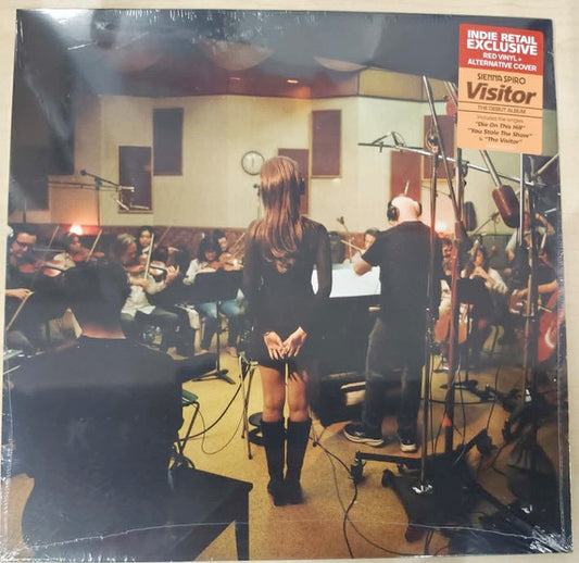 Image of Front Cover of LP - NEW/NEW - SIENNA SPIRO, Visitor (Capitol; 5778397, Europe 2026, Red Vinyl with Alternate Sleeve), , A phenomenal new vocal talent with uncompromising vision, SIENNA SPIRO is here with her debut album, Visitor, a striking opening statement from an artist of undeniable longevity. Visitor Features Billboard charting & RIAA Platinum & Gold singles  Die On This Hill  &  You Stole The Show , as well as new hit single  The Visitor . Having amassed over 1.3 Billion streams ahead of her 