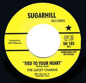 Image of Front Cover of 7" - /VG+ - THE LUCKY CHARMS, Tied To Your Heart (Sugarhill Records; SH 102, UK Reissue), Light marks,  - 2556117S