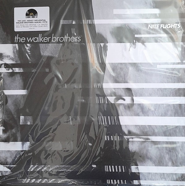Image of Front Cover of LP - EX/EX - THE WALKER BROTHERS, Nite Flights (Commercial Group; 19958410851, UK 2026, Gatefold, Ultra Clear Bio Vinyl), , x1 Ultra Clear Bio LP Vinyl - A first ever colour pressing for the sixth and final studio album by the Walker Brothers, initially released in July 1978, which has been cut to lacquer from the original   inch master tapes. The last of their three albums issued on GTO Records, unlike its predecessors it was made up entirely of original songs and, though it was lar