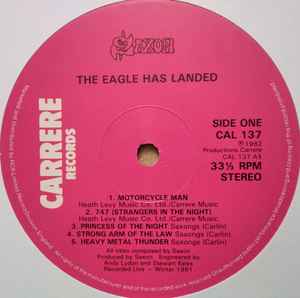 Image of Label Cover of LP - VG/VG+ - SAXON, The Eagle Has Landed (Live) (Carrere; CAL 137, UK 1982, Embossed Sleeve, Stickered Sleeve), Hype sticker still intact, sticker damage & old sticker remnants, edge wear,  - 2746022S