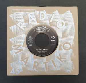 Image of Front Cover of 7" - EX/VG+ - THE LATINS / ALBA AND ORCHESTRE ARIS, Habibi Twist / Alba's Shake (Radio Martiko ; RM001, Belgium 2022 Reissue, Company Sleeve), , This killer double sider features 2 dance tunes from the early 60's, combining the best of the East and the West. Each of these 2 dance floor fillers is unique in its own way. Getting these tunes on original 45 is rather tough so grab your chance! - 2726100E
