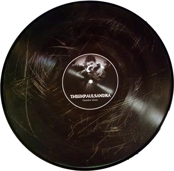 Image of Front Cover of 12" EP - /VG+ - THIGHPAULSANDRA, Chamber Music (Lumberton Trading Company; LUMB002LP, UK 2006), , Chamber Music is the fifth album by Thighpaulsandra. The album is the first to be pressed to both CD and vinyl since The Michel Publicity Window E.P.. The vinyl pressing was limited to an edition of 525, hand numbered picture discs.A1	Cast In Dead HomesA2	A Blizzard Of AltarsB1	Bleeding Text For The CripplethrushB2	The Unwilling Wardens Of Ice - 2826037E