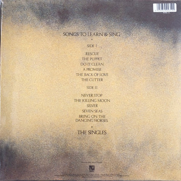 Image of Back Cover of LP - NEW/NEW - ECHO & THE BUNNYMEN, Songs To Learn & Sing (Warner Strategic Marketing; , UK 2026 Reissue, Card Sleeve, Yellow & Black Marble Vinyl), , By the release of Songs To Learn & Sing, Echo & The Bunnymen were a force to be reckoned with, pioneering the post-punk, new wave scene having released four highly acclaimed albums, Crocodiles, Heaven Up Here, Porcupine and Ocean Rain. Originally released in 1985, Songs To Learn & Sing is a comprehensive collection of Echo & The Bunnyme