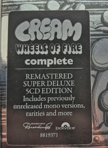 Image of Back Cover of 5xCD - NEW/NEW - CREAM, Wheels Of Fire (Polydor; 8819371, Worldwide 2026, Box Set), , The physical 5CD collection is housed in a 10-inch rigid slipcase finished with a unique silver lamination. It includes individual gatefold folios for the discs and a high-quality hardcover book containing rare archival photographs and extensive liner notes by music critic Jim Farber. - 2836121E