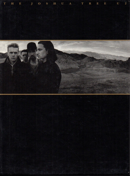 Image of Front Cover of 2xCD - VG/VG+ - U2, The Joshua Tree (Mercury Music Group; 1750948, Europe 2007, Box Set, Limited Edition, 20th Anniversary Super Deluxe Edition with DVD), Also includes a 56 page hardback embossed book, featuring previously unseen photos and handwritten lyrics. Also a cardboard 'wallet' containing 5 black & white postcards. Gold limited edition hype stickers on the inside of the case.,  - S