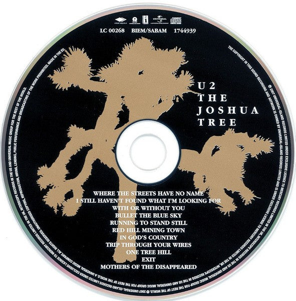 Image of Label Cover of 2xCD - VG/VG+ - U2, The Joshua Tree (Mercury Music Group; 1750948, Europe 2007, Box Set, Limited Edition, 20th Anniversary Super Deluxe Edition with DVD), Also includes a 56 page hardback embossed book, featuring previously unseen photos and handwritten lyrics. Also a cardboard 'wallet' containing 5 black & white postcards. Gold limited edition hype stickers on the inside of the case.,  - S
