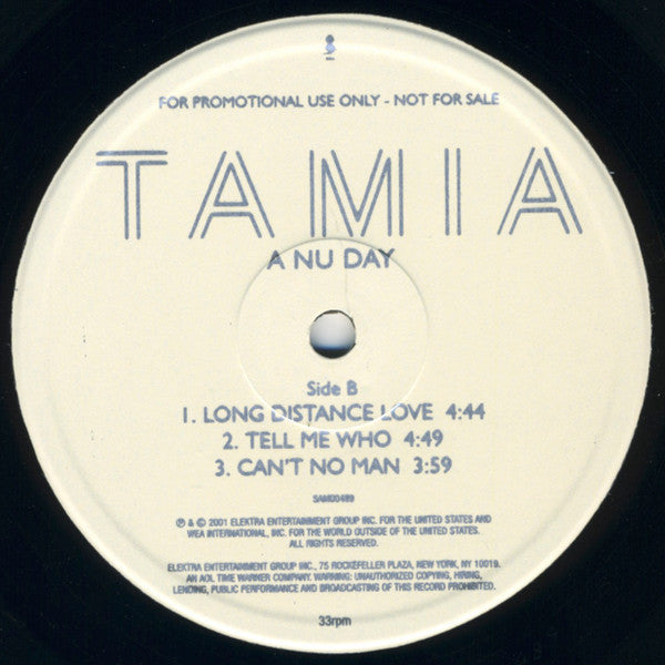 Image of Label Cover of 12" - VG/VG - TAMIA, A Nu Day (Elektra; SAM00489, UK 2000, Promo, Sampler), , Sampler for A Nu Day, the second studio album by Tamia. A less ballad-driven collection of songs and more progressive approach than her debut effort, Tamia worked with a smaller number of songwriters and producers on the album, including Dallas Austin, Shep Crawford, Missy Elliott, Bink!, Errol "Poppi" McCalla, and Jazz Nixon. - 2926327E
