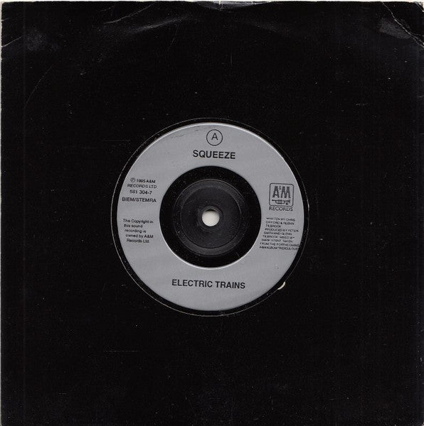 Image of Front Cover of 7" - VG+/VG+ - SQUEEZE, Electric Trains (A&M Records; 581 304-7, UK 1995, Barcode Stickered Plain Black Sleeve), Small promo stickers on label and sleeve, light crease to top.,  - 3016281C