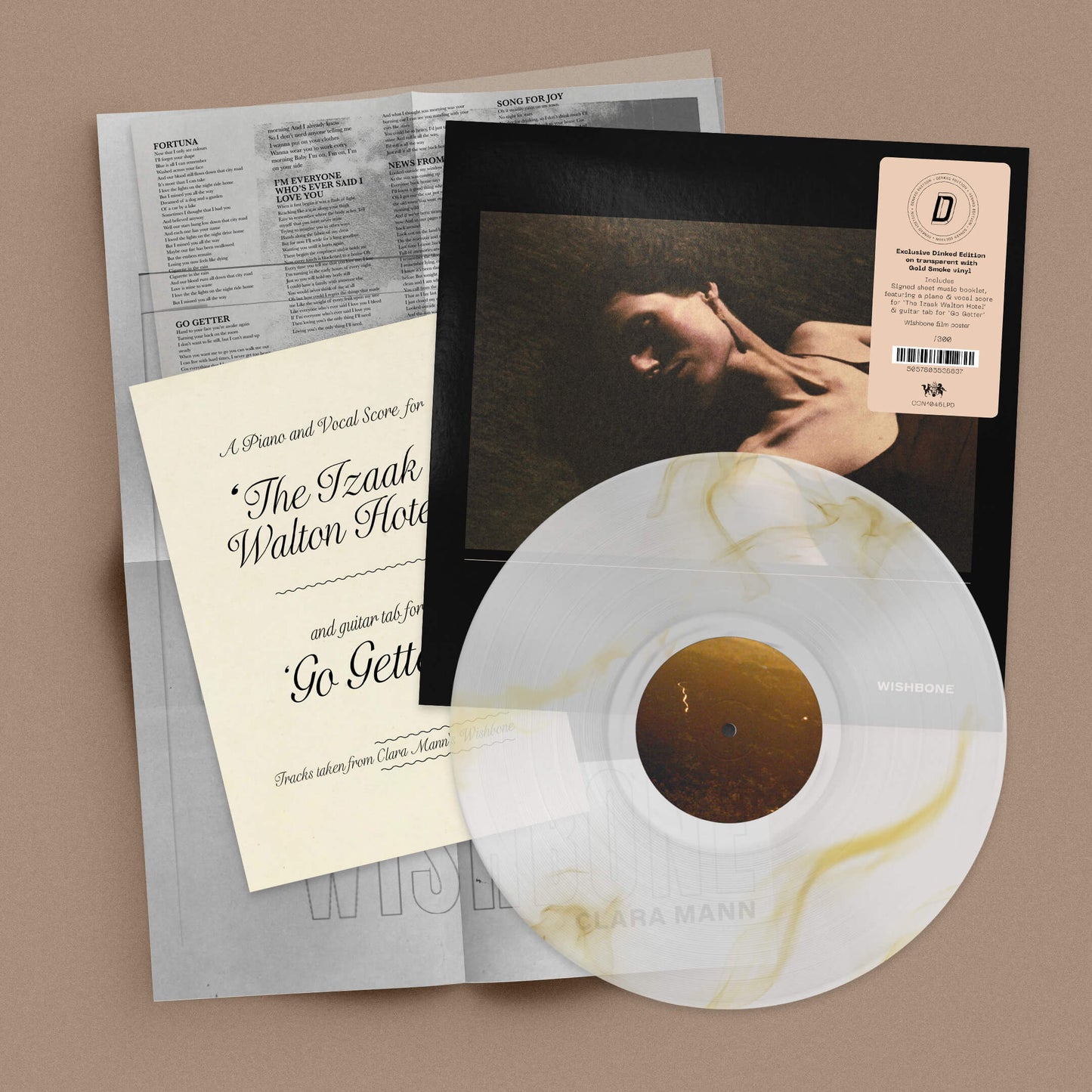 Image of Front Cover of LP - NEW/NEW - CLARA MANN, Wishbone - Dinked Edition (The state51 Conspiracy; CON1046LPD, UK 2026, Transparent with Gold Smoke Vinyl, Limited Numbered Pressing of 300, Dinked Edition No. 433, Signed A4 sheet music booklet, featuring a piano and vocal score for 'The Izaak Walton Hotel’ & guitar tab for ‘Go Getter’, Folded A2 Wishbone film poster. ), , Clara Mann’s luminous new album, Wishbone, is built on contrast; the brightest passages made legible by shadow, as Mann strove to pict
