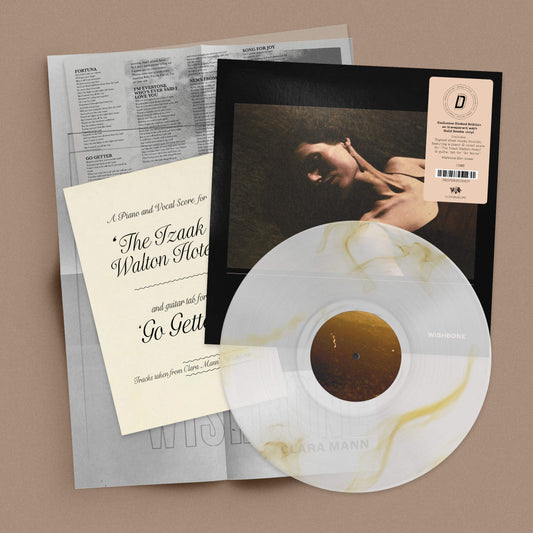 Image of Front Cover of LP - NEW/NEW - CLARA MANN, Wishbone - Dinked Edition (The state51 Conspiracy; CON1046LPD, UK 2026, Transparent with Gold Smoke Vinyl, Limited Numbered Pressing of 300, Dinked Edition No. 433, Signed A4 sheet music booklet, featuring a piano and vocal score for 'The Izaak Walton Hotel’ & guitar tab for ‘Go Getter’, Folded A2 Wishbone film poster. ), , Clara Mann’s luminous new album, Wishbone, is built on contrast; the brightest passages made legible by shadow, as Mann strove to pict